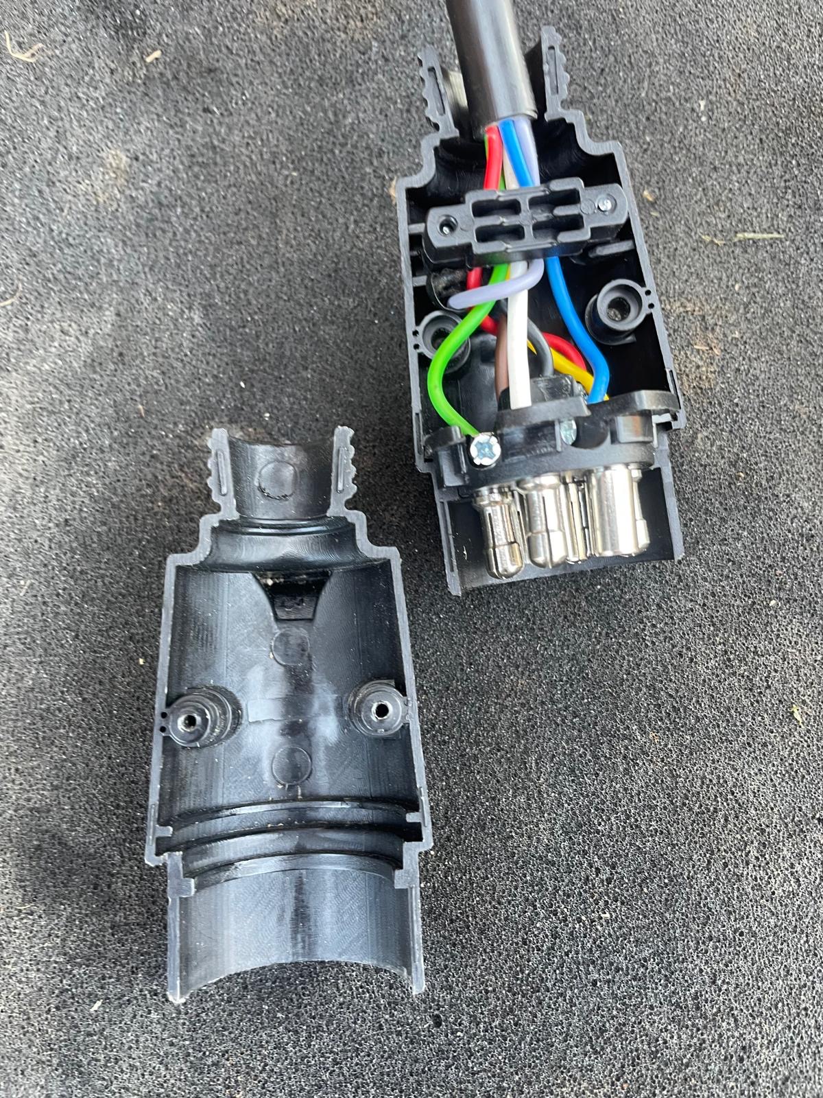 7 pin 12N trailer plug opened up showing the pin terminals and wiring entry